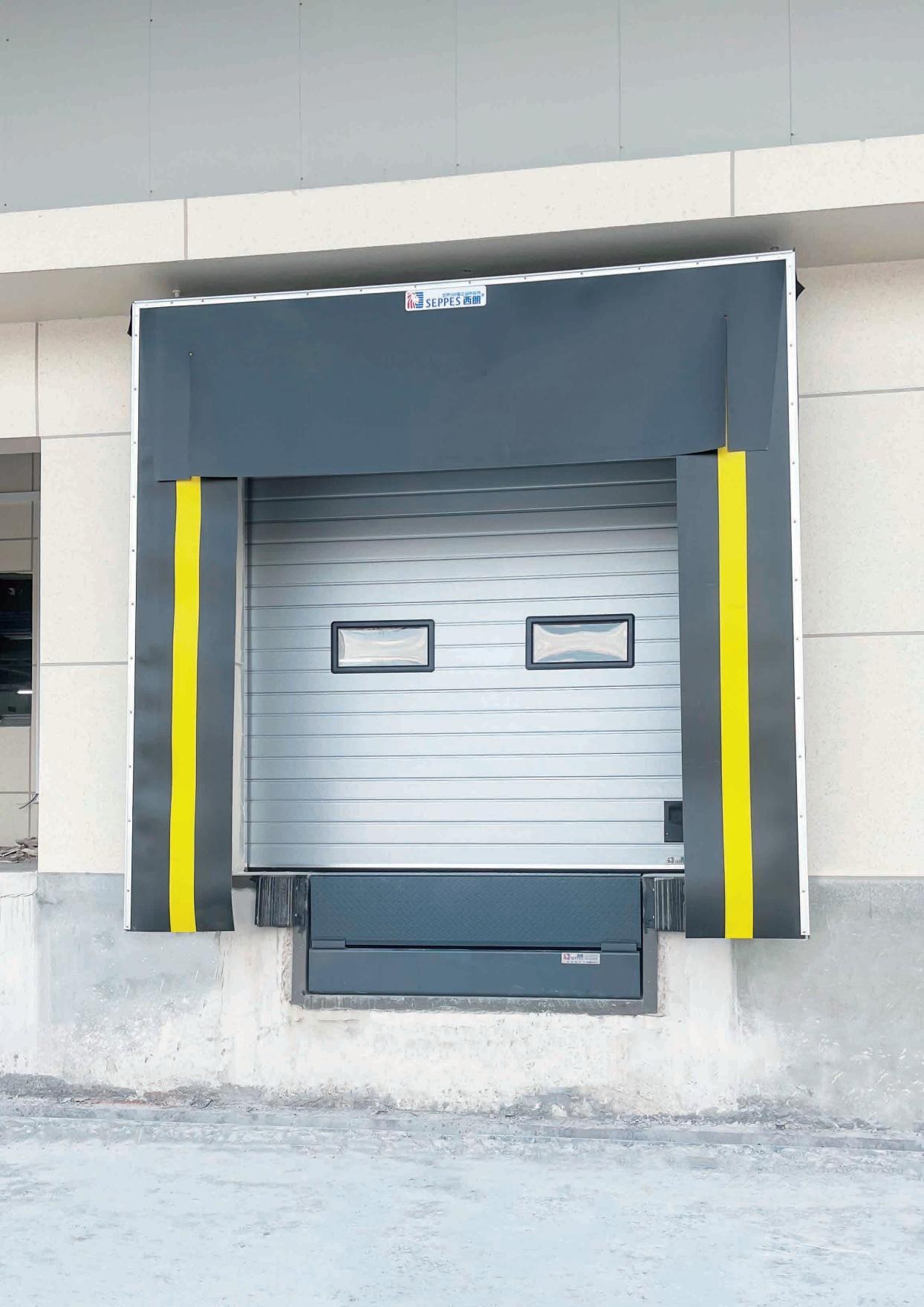 Logistics loading dock with forklift and hydraulic dock leveler