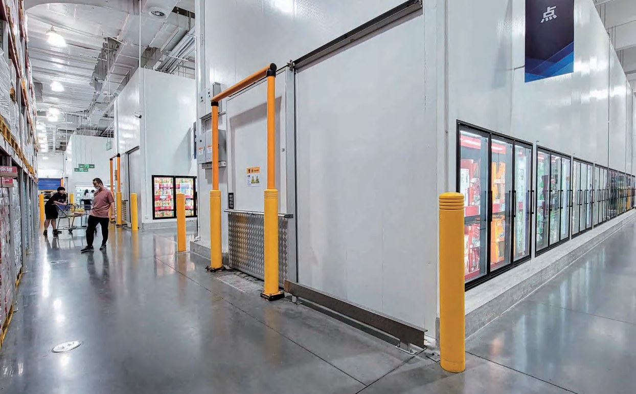 Manufacturing plant loading area with industrial doors and safety barriers
