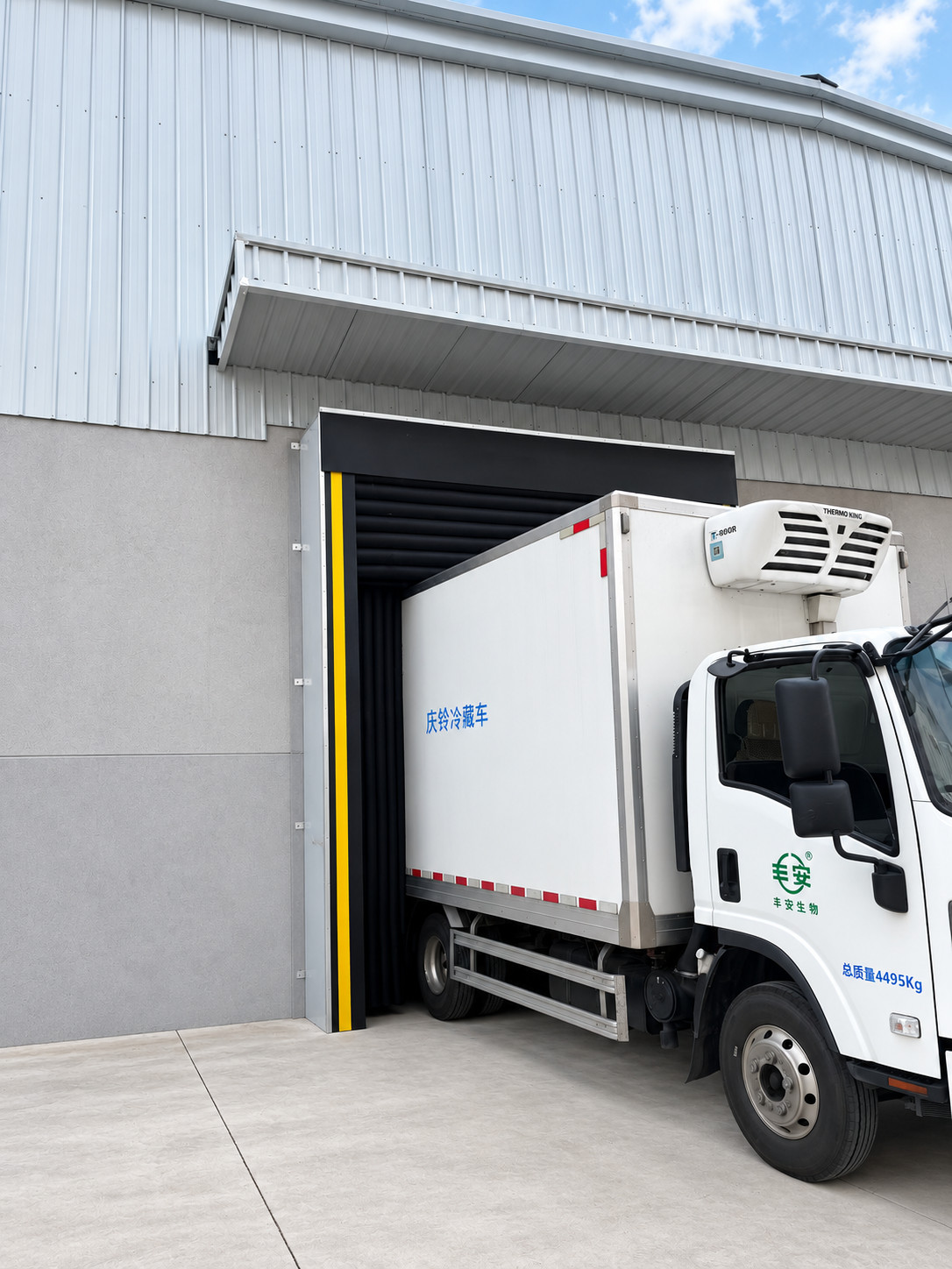 Loading dock safety with dock shelter and refrigerated truck