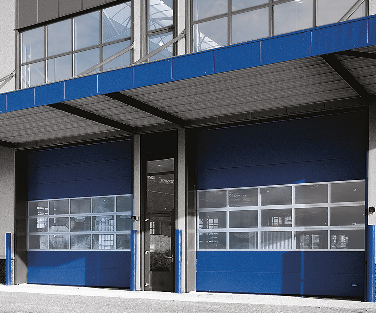 Industrial sectional overhead doors installed at a commercial manufacturing facility