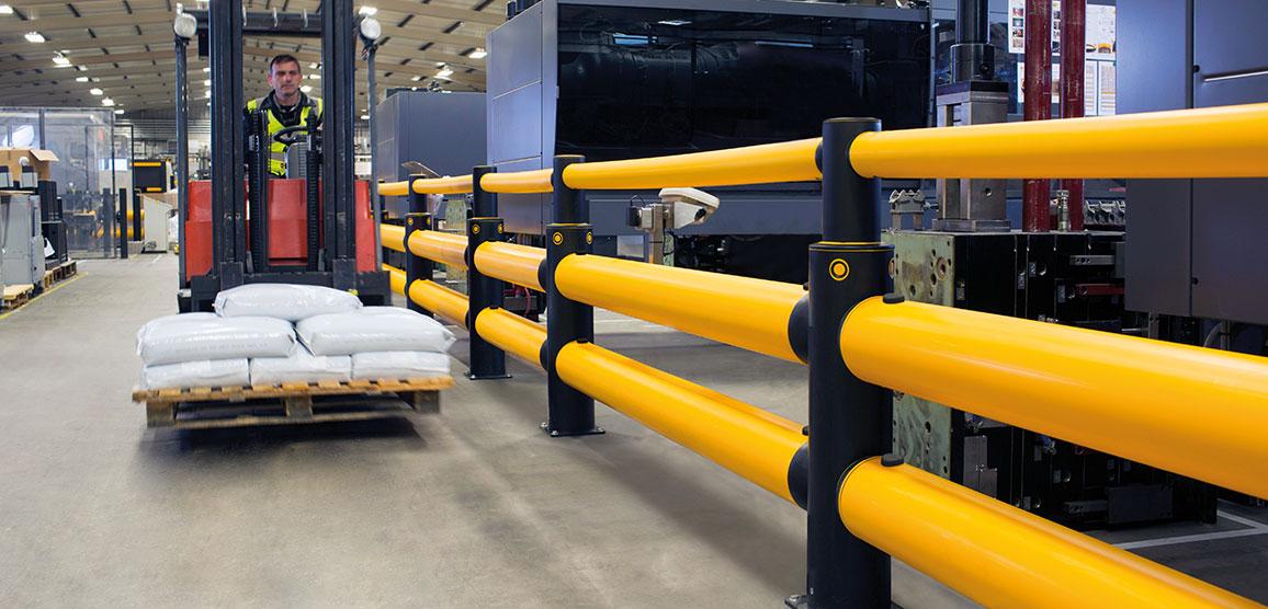 Industrial guardrails providing forklift impact protection around machinery